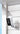 ieGeek smart home battery-powerd security camera named ZY-C1 mounted on a wooden wall with a clear blue sky.