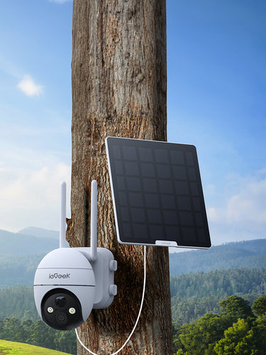 ieGeek smart 4G security camera with solar panel attached to a tree in a scenic outdoor setting.