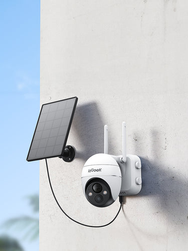 ieGeek outdoor security camera with solar panel attached to a wall